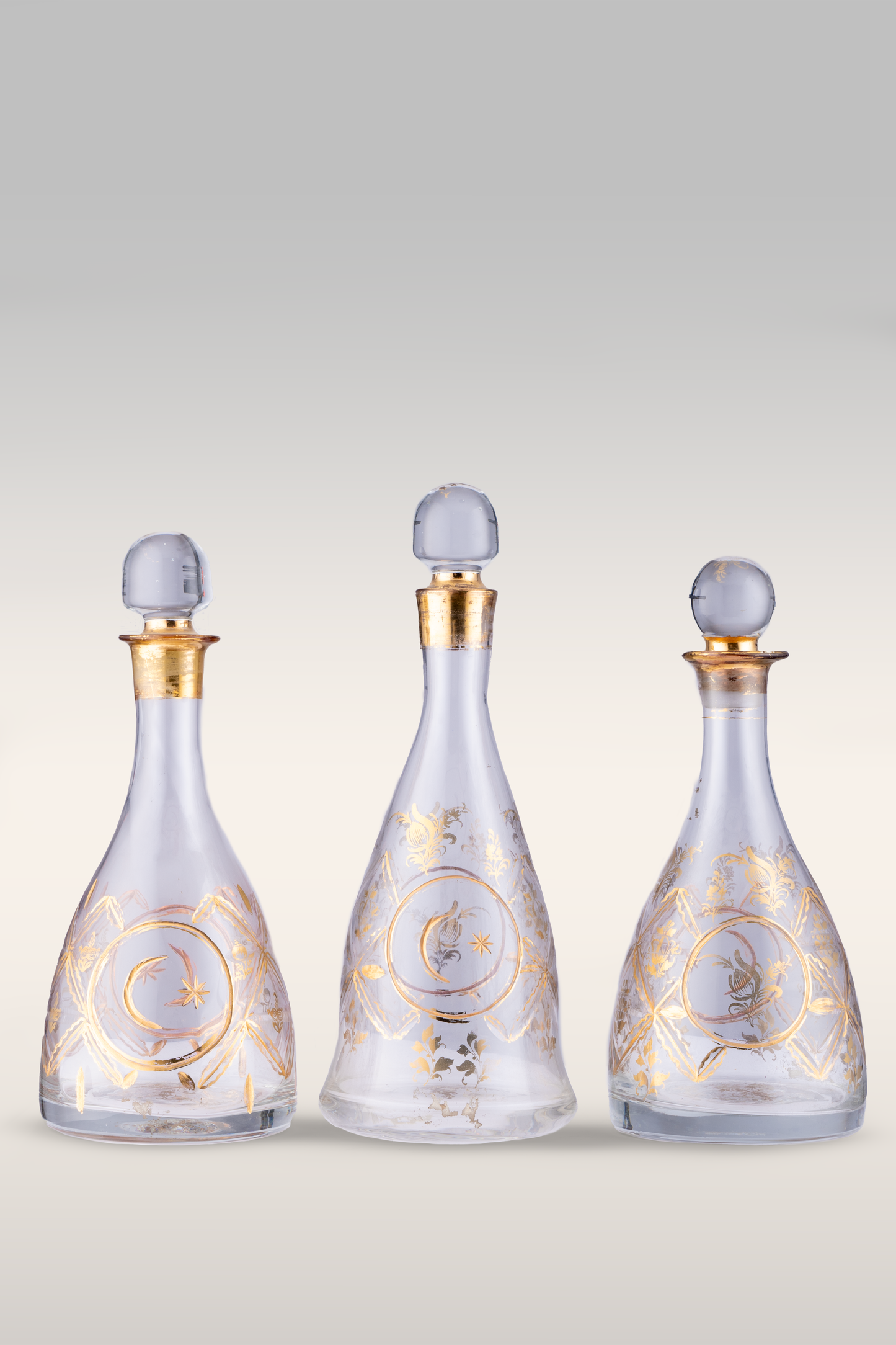 A Set of Three Old Ottoman Beykoz Decanters with Gold Decorations